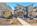 Exterior home view featuring landscaping and appealing architectural design at 23527 E 5Th Pl, Aurora, CO 80018