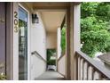 Welcoming entryway leading to unit 203, featuring a secure door and well-lit stairway at 8775 W Berry Ave # 203, Littleton, CO 80123