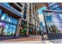 Modern brick building with storefronts and clear signs near 16th Street Mall at 1901 Wazee St # 807, Denver, CO 80202