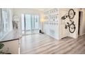 Bright, open-concept living space with sliding glass doors, modern flooring, and contemporary decor at 5027 N Walden Way, Denver, CO 80249
