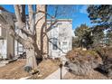 Cozy townhouse exterior with a well-maintained front yard at 8867 W Floyd Ave, Lakewood, CO 80227