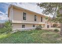 The side of the house has great lighting with a large grassy area at 15691 E Atlantic Cir, Aurora, CO 80013