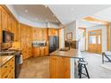 Well-equipped kitchen featuring wooden cabinetry, stainless steel appliances, and a functional center island at 293 Settlers Dr, Breckenridge, CO 80424