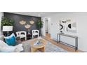 Spacious living room featuring modern decor, natural light, and stylish furnishings at 5505 Brentwood St, Arvada, CO 80002