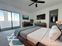 The main bedroom has a modern design and an attached balcony for added living space at 11113 E Alameda # 207, Aurora, CO 80014