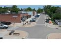 Street view showcasing local businesses and parking in a quiet town neighborhood at 5425 County Rd 32 # 27, Mead, CO 80504
