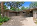 Close up of two car garage with wooden doors at 2717 S Langley Ct, Denver, CO 80210