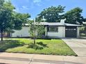 Landscaped front yard with mature trees surrounding this adorable single-story home at 8873 Princeton St, Westminster, CO 80031