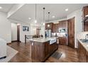 Gourmet kitchen with stainless steel appliances and granite countertops at 2794 Heron Lakes Pkwy, Berthoud, CO 80513