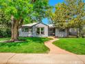 Inviting home exterior with a manicured lawn and a charming walkway at 5152 Bryant St, Denver, CO 80221