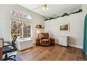 Bright office space with hardwood floors, a large window and cozy chair at 13668 Plaster Cir, Broomfield, CO 80023