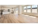 Bright open floor plan featuring hardwood floors, large windows and abundant natural light at 10984 Snowdon St, Parker, CO 80134