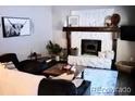 Cozy living room with an inviting fireplace and comfortable seating at 9092 Gray Ln, Conifer, CO 80433