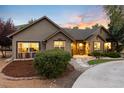 Charming single-story home featuring professional landscaping, decorative rock and inviting curb appeal at 1392 W Caley Ave, Littleton, CO 80120