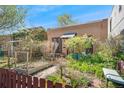 Inviting home showcasing a lush front yard with garden beds and charming curb appeal at 34 W Maple Ave, Denver, CO 80223