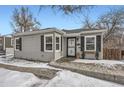 Gray house with black shutters, snowy front yard, and walkway at 2354 S Ogden St, Denver, CO 80210