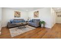 Cozy living room with hardwood floors, stylish decor and comfortable seating at 6193 Holland St, Arvada, CO 80004