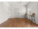 Living room featuring hardwood floors, neutral colors, and a window for natural light at 1771 W 53Rd Pl # 1, Denver, CO 80221