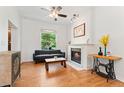 Inviting living room with a cozy fireplace, hardwood floors, and stylish decor at 2829 N Franklin St, Denver, CO 80205