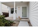 Charming home featuring a welcoming front porch and a delightful dog at 4264 Thorndyke Pl, Broomfield, CO 80020