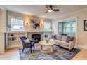 Inviting living room with a decorative fireplace, built-in shelves, and lots of natural light at 840 S Corona St, Denver, CO 80209