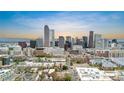 Breathtaking city skyline view showcases Denver's modern architecture, capturing the vibrant cityscape against a colorful sky at 624 E 18Th Ave # 3, Denver, CO 80203