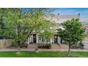 Charming duplex with shared front yard, classic architecture, and inviting entrances framed by trees, perfect for urban living at 624 E 18Th Ave # 3, Denver, CO 80203