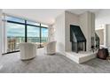 Cozy living room showcasing a fireplace, comfortable seating, and expansive city views at 1777 Larimer St # 2201, Denver, CO 80202