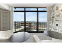 Modern living room featuring floor-to-ceiling windows with city views and sleek decor at 1777 Larimer St # 2201, Denver, CO 80202
