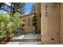 Cozy entrance with decorative ironwork, potted plants, and a charming seating area at 2107 Ridge Plaza Dr, Castle Rock, CO 80108