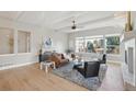 Bright living room with large windows, hardwood floors, and neutral color palette at 14642 Sorrel Dr, Broomfield, CO 80023