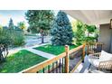 Relaxing front porch view of a tree-lined street at 3061 S Grant St, Englewood, CO 80113