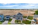 Lovely home featuring a spacious yard, a detached garage, and is near a construction site at 9515 E 109Th Cir, Commerce City, CO 80640