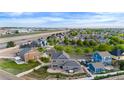 This home features a large lot with a patio, hot tub, and it is conveniently located near a highway at 9515 E 109Th Cir, Commerce City, CO 80640