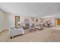 Spacious living room features comfortable seating, an open layout, and adjacent dining area perfect for entertaining at 31 Irene Ct, Broomfield, CO 80020
