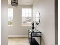 Inviting entryway boasting wood floors and contemporary decor at 6303 Elmira St, Denver, CO 80238