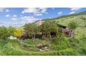 Charming hillside home with mature trees, terraced gardens, and inviting deck at 2605 Cactus Cir, Golden, CO 80401