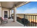 Relax on this spacious balcony with seating and stunning mountain views at 2405 Calais Dr # 18A, Longmont, CO 80504
