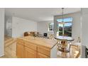 Open floor plan connecting the living and dining areas, with a cozy seating area at 740 Boxwood Ln, Longmont, CO 80503