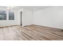 Spacious living area featuring hardwood floors and recessed lighting, ready for customization at 3360 N Coolidge Way Way, Aurora, CO 80019