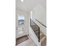 Bright entryway featuring a staircase with modern railing and a glass front door at 1261 Penner Dr, Erie, CO 80026