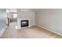 Bright living room with a fireplace and neutral decor at 9737 Canberra Ct, Highlands Ranch, CO 80130