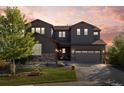 Charming two-story home with a large front yard, stone accents, and a two-car garage at 853 Stagecoach Dr, Lafayette, CO 80026