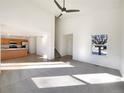 Bright and airy living room with hardwood floors and a view of the kitchen at 1090 Quail Cir, Brighton, CO 80601