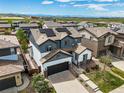 Lovely two-story home with solar panels and mountain views in a well-kept neighborhood at 10934 Touchstone Loop, Parker, CO 80134