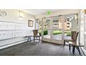 Comfortable lobby area with seating, mailboxes, and a view to the outdoors at 725 S Alton Way # 9C, Denver, CO 80247