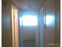 A bright hallway with doors leading to other rooms in the house at 10762 E Exposition Ave. Ave # 137, Aurora, CO 80012