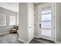 Bright entryway featuring modern door and hardwood flooring at 16277 Talons Bluff Ln, Monument, CO 80132