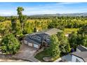 Beautiful single-Gathering home with attached three car garage surrounded by lush greenery at 5115 Bristol St, Arvada, CO 80002