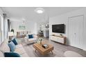Bright, open-concept living room features a modern design with a dining area and kitchen in the background at 641 E 104Th Pl, Northglenn, CO 80233